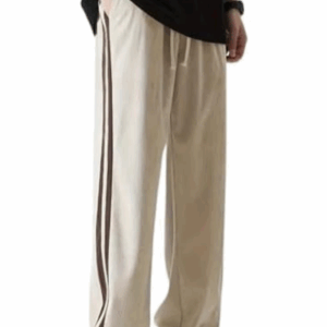 Mens beige trousers are a versatile wardrobe essential, combining breathable fabric, an adjustable waistband, and a relaxed fit to provide all-day comfort, whether you're lounging, exercising, or heading out casually.